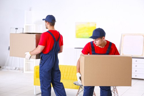 Removal team preparing a Hounslow home move with boxes and furniture