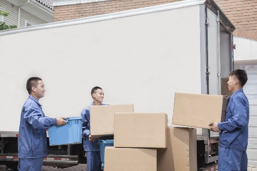 Loading furniture into a moving truck near Hounslow properties
