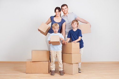 Loading furniture and boxes into a removal truck in West London