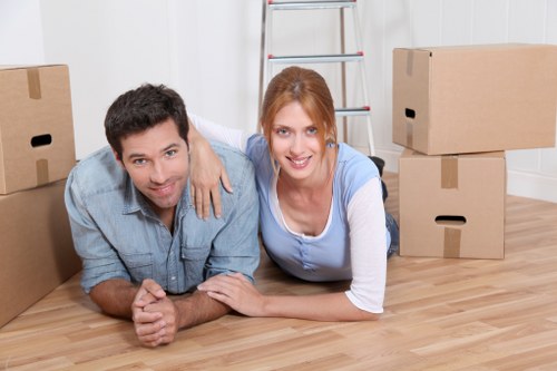 Careful furniture handling during a house move in West London