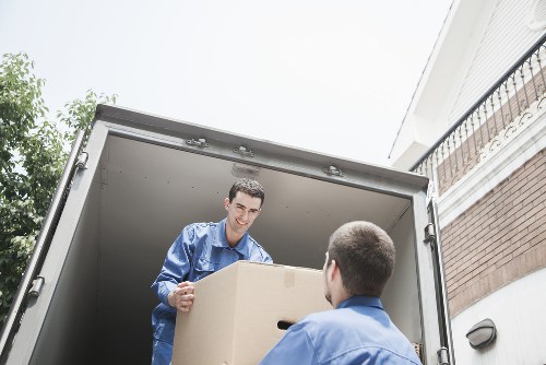 Van loading household furniture for transport in Hounslow