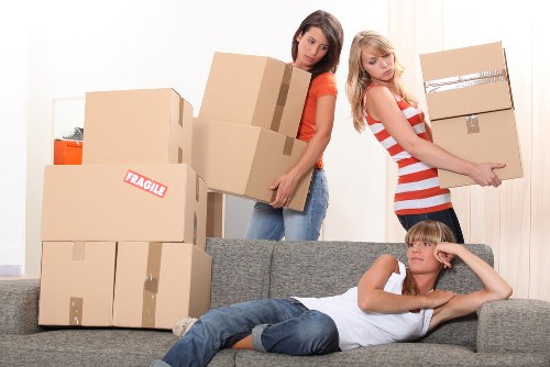 Professional movers loading furniture for an urgent relocation in Hounslow